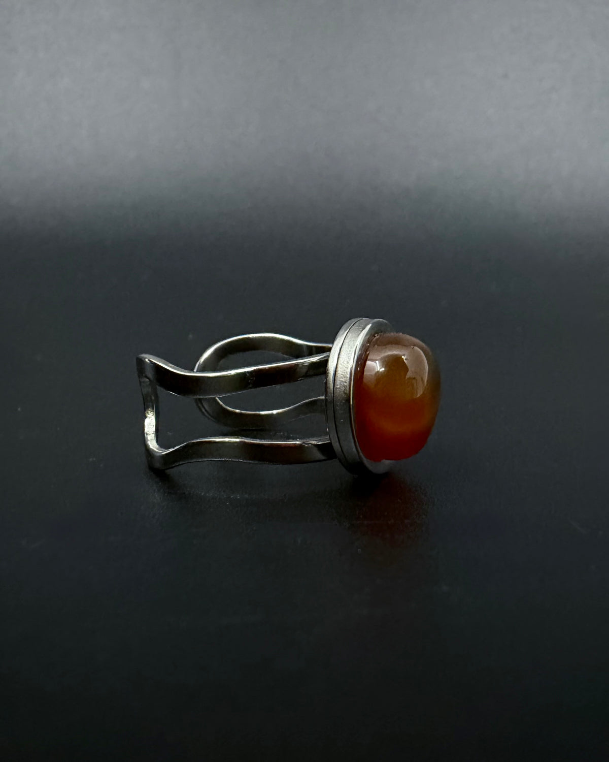 Silver adjustable statement ring with 10mm domed carnelian gemstone, double-shank stainless steel band, Nebulae Core Ring by Lawless Jewellery