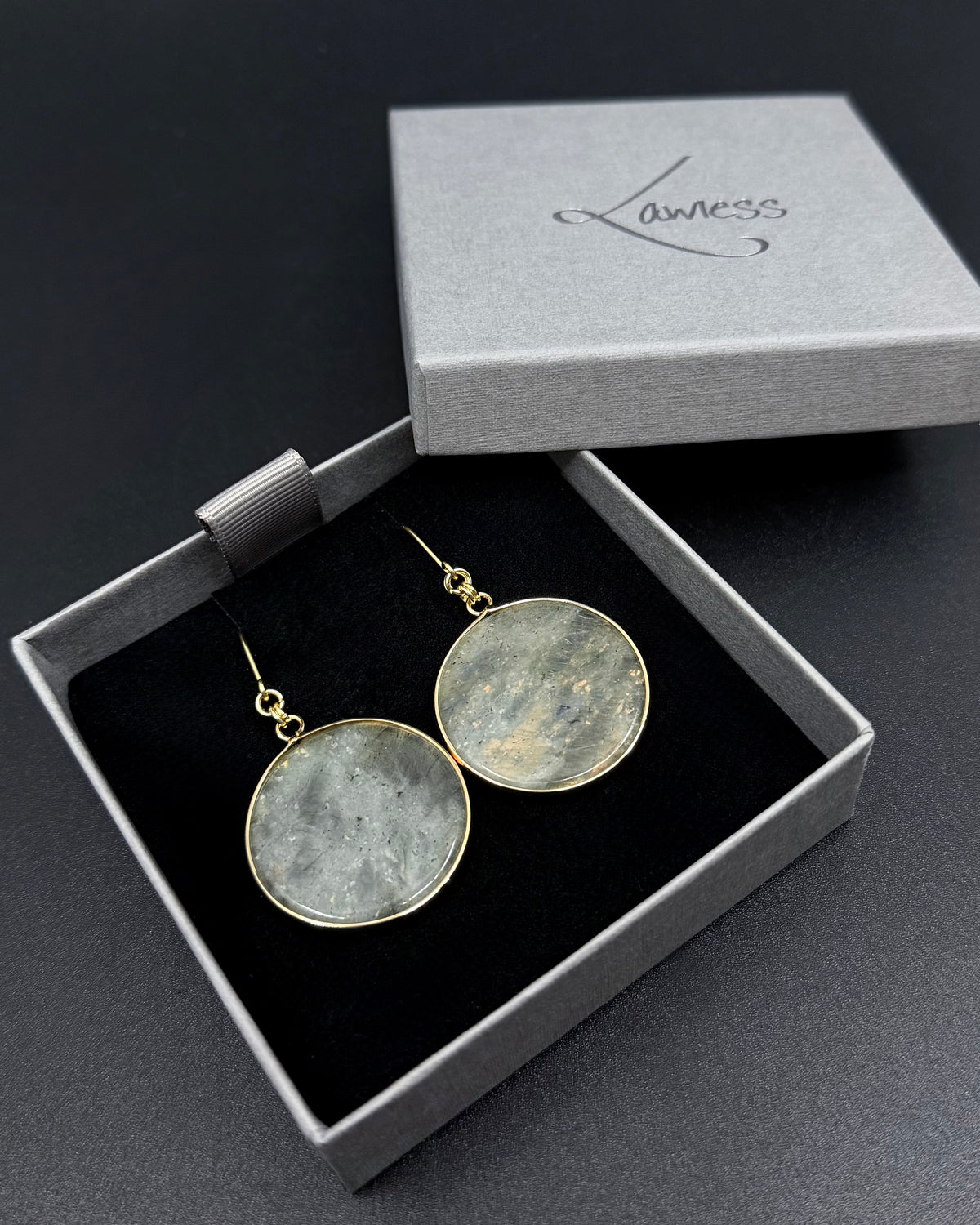 Nebulae Trace Earrings in Labradorite with 30mm grey gemstone discs showing blue iridescent flash and gold stainless steel hooks, celestial drop earrings by Lawless Jewellery