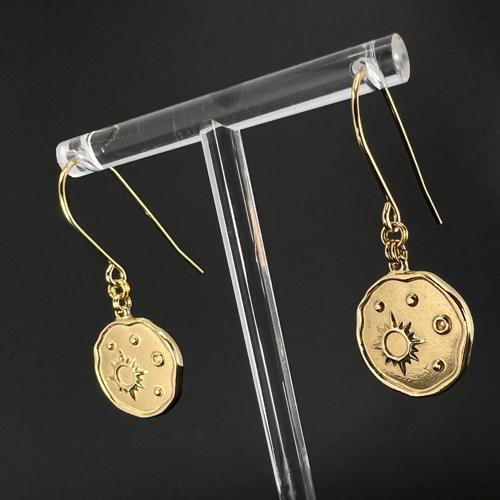 Gold-plated stainless steel earrings with engraved star-motif discs, 1.5 cm wide with a 4 cm drop — Azimuth Earrings, Lawless Jewellery.