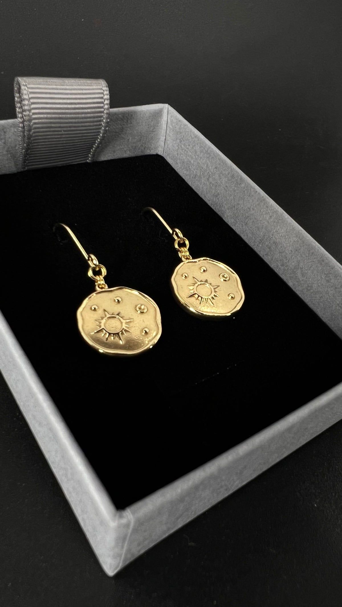 Gold-plated stainless steel earrings with engraved star-motif discs, 1.5 cm wide with a 4 cm drop — Azimuth Earrings, Lawless Jewellery.
