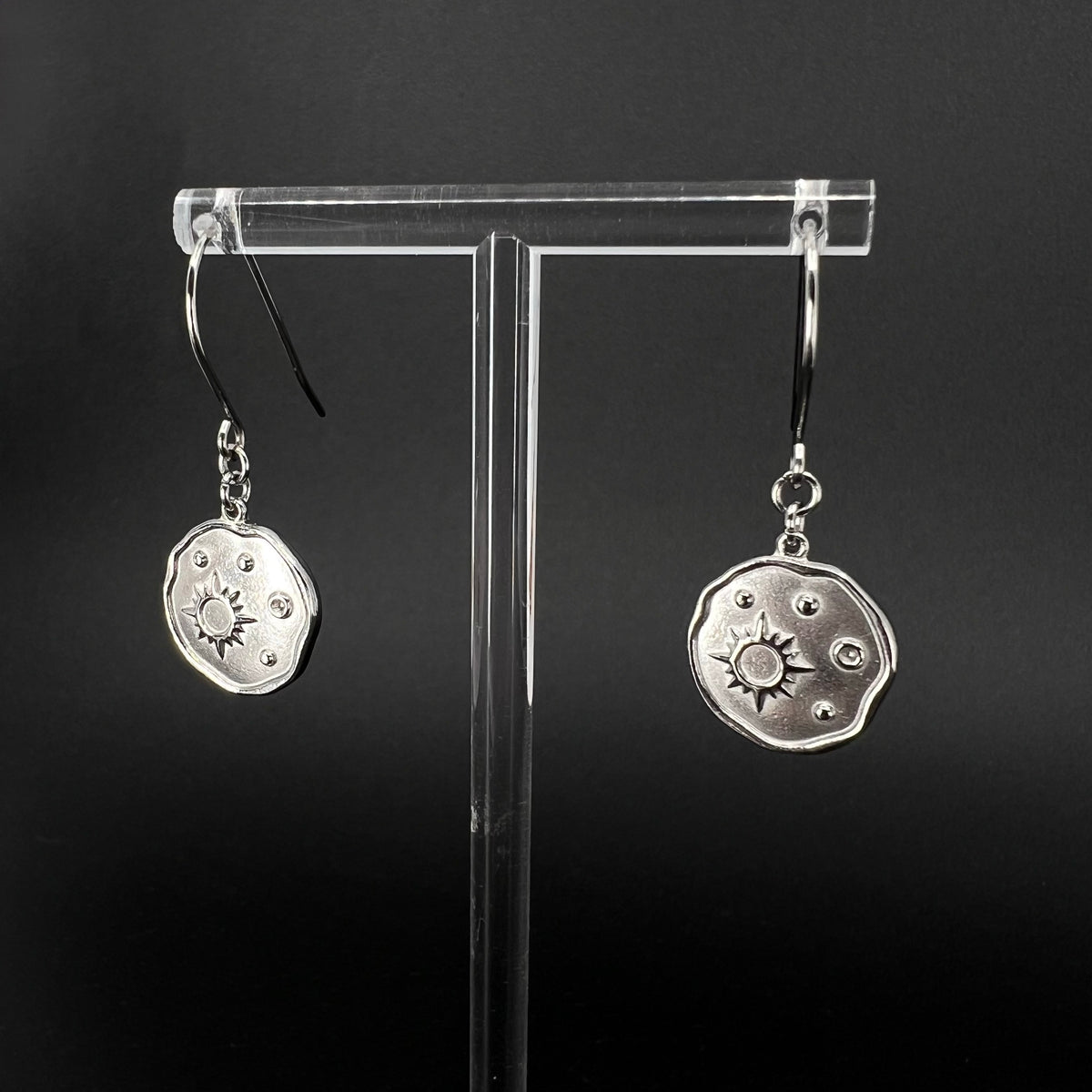 Silver stainless steel earrings with engraved star-motif discs, 1.5 cm wide with a 4 cm drop — Azimuth Earrings, Lawless Jewellery