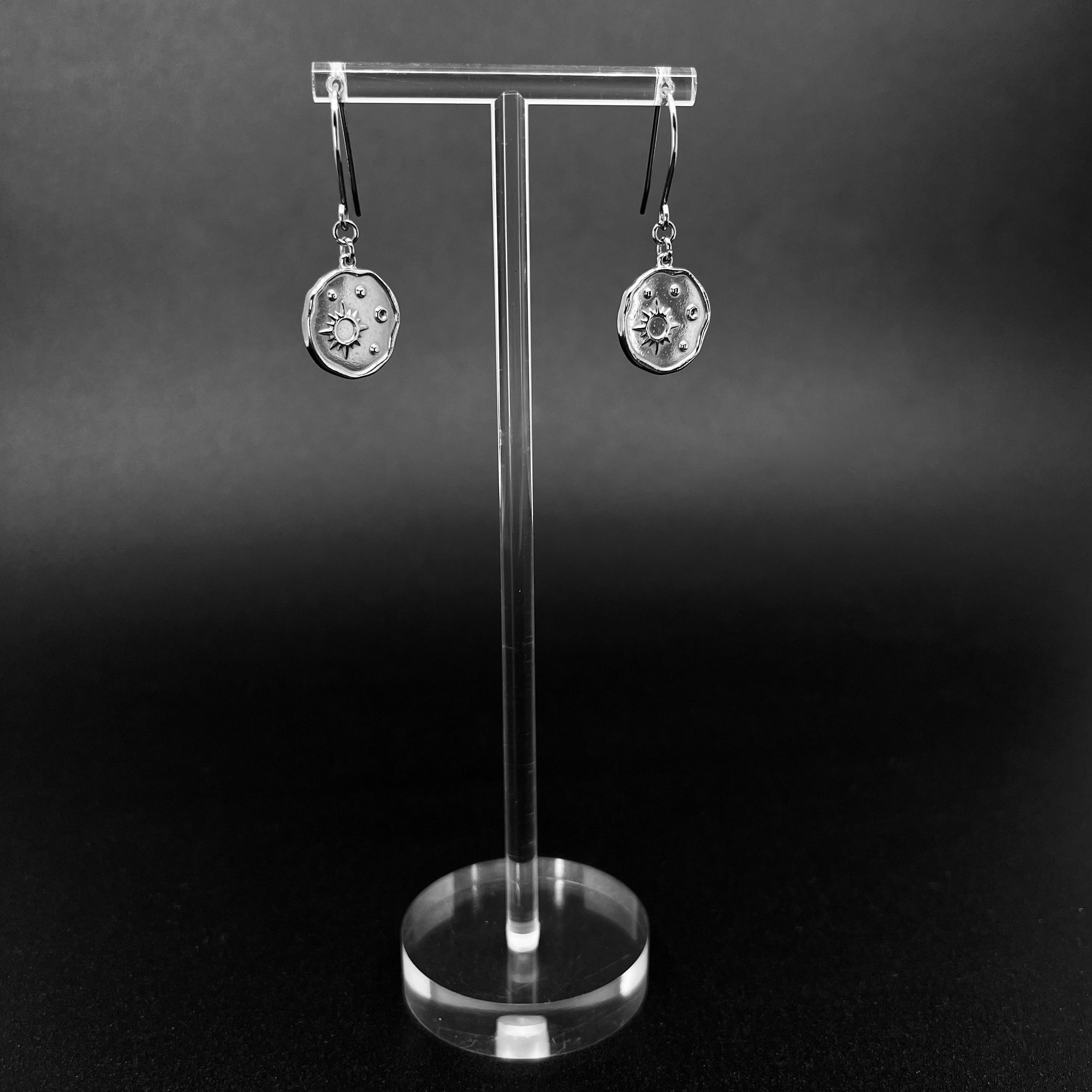 Silver stainless steel earrings with engraved star-motif discs, 1.5 cm wide with a 4 cm drop — Azimuth Earrings, Lawless Jewellery