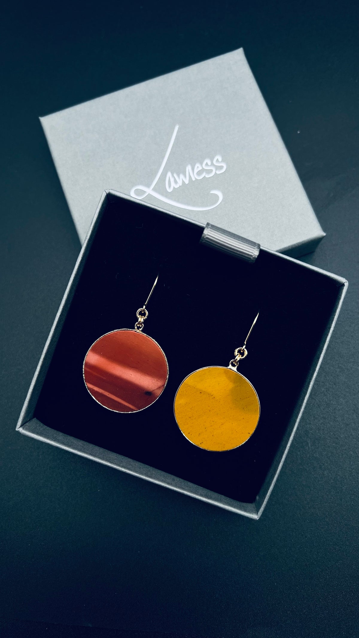 Gold-framed natural Mookaite stone earrings in red and yellow tones with gold-plated stainless steel ear fittings, 5.5 cm length — Lawless Jewellery.