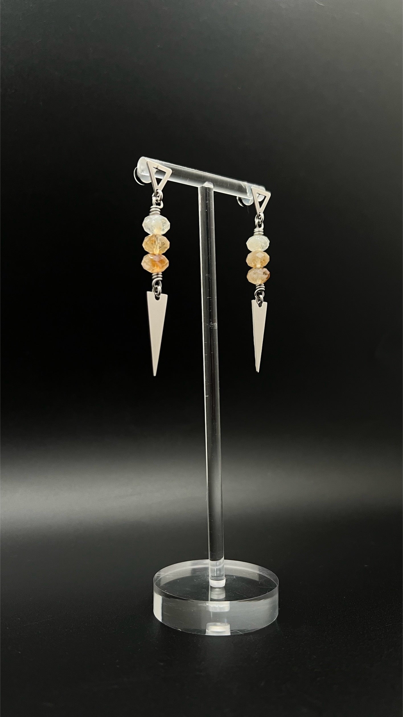 Stainless steel spear-drop earrings with triangle studs and three faceted citrine gemstones, inspired by Orion’s celestial geometry — Lawless Jewellery.