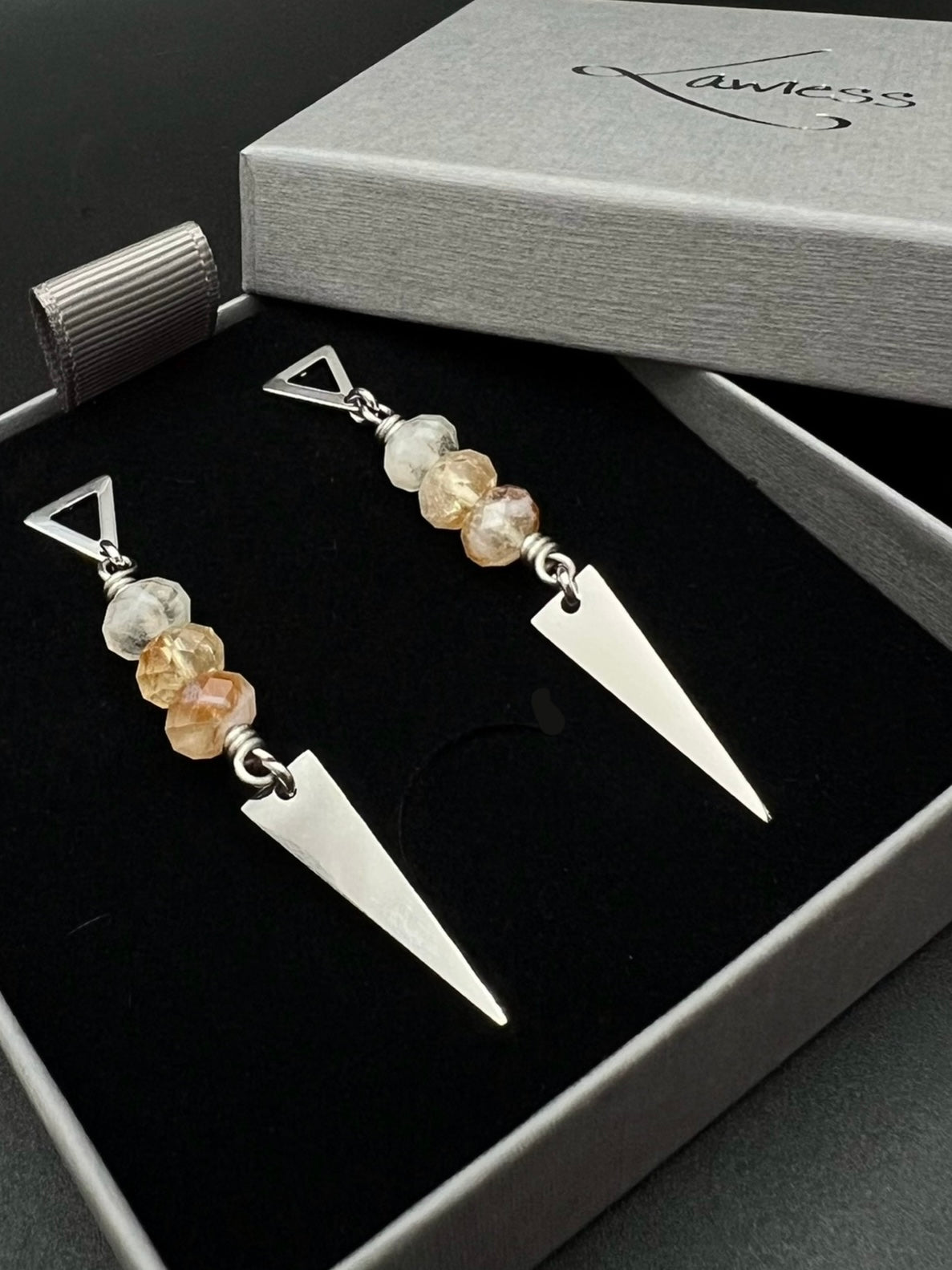 Stainless steel spear-drop earrings with triangle studs and three faceted citrine gemstones, inspired by Orion’s celestial geometry — Lawless Jewellery.
