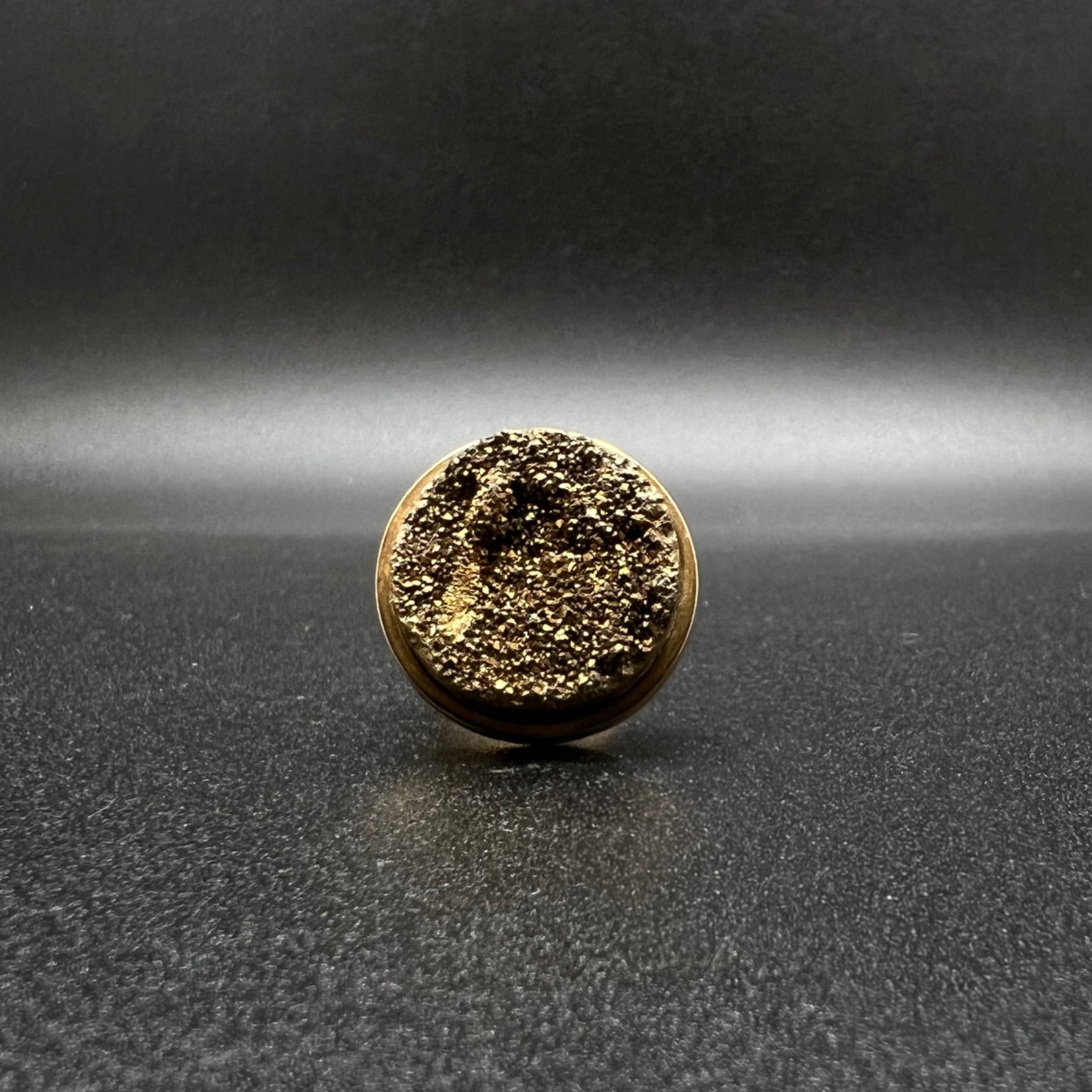 Set of three gold-plated stainless steel rings featuring 20 mm cabochons in Clear Quartz, Gold Druzy, and Carnelian on adjustable double-shank bands — Lawless Jewellery.