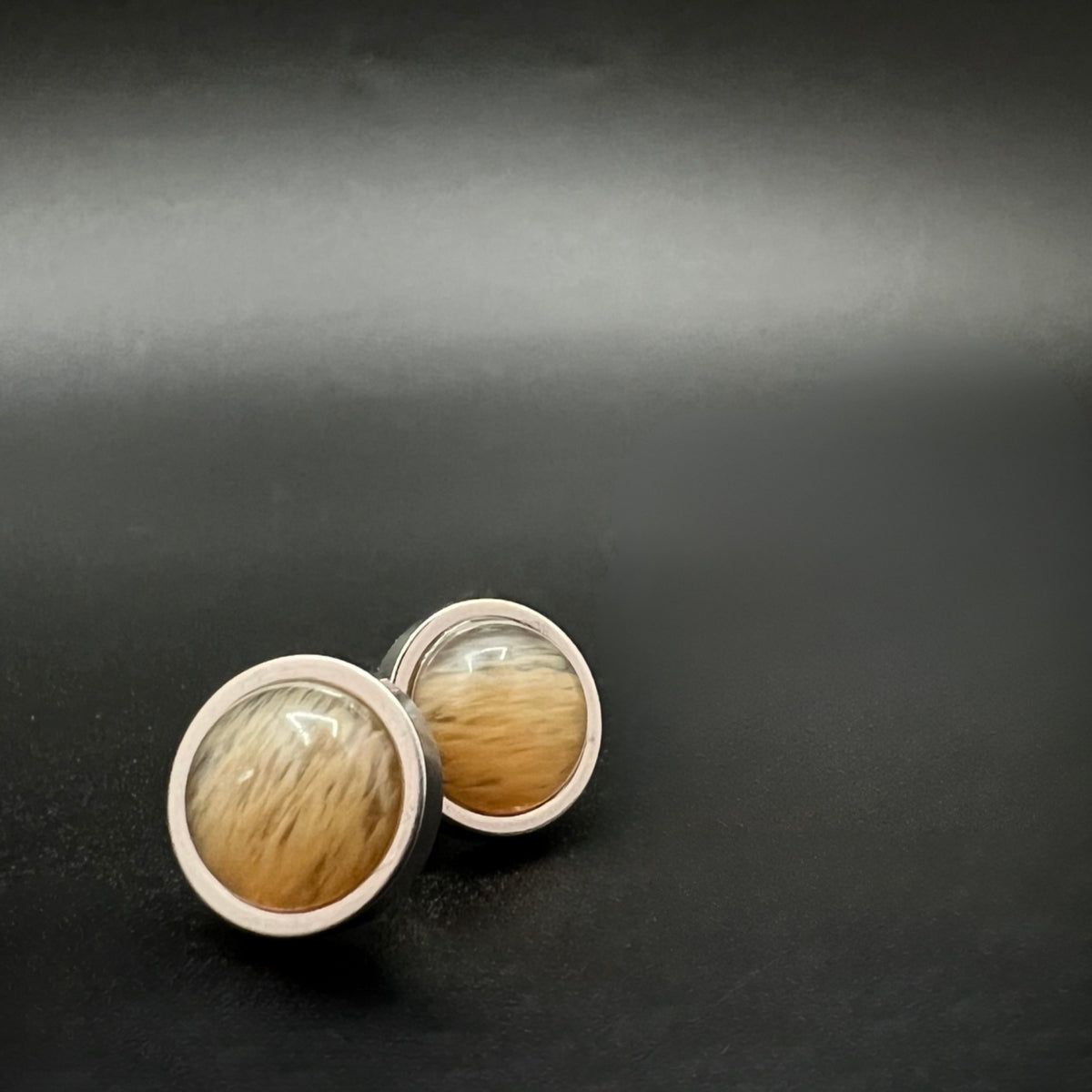 Stainless steel stud earrings with domed yellow-orange watermelon glass cabochons, 10 mm studs with 8 mm cabochons — Lawless Jewellery.