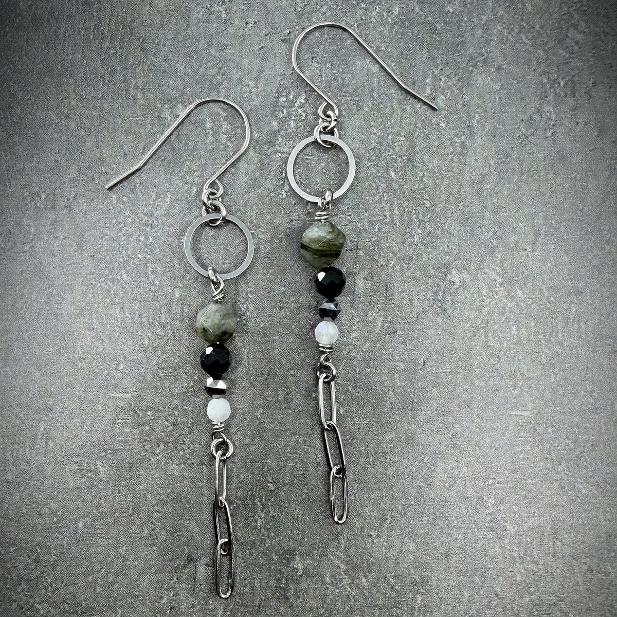Mixed gemstone drop earrings featuring Labradorite, Black Spinel, Moonstone, and Terahertz set in stainless steel, in black, grey, white, and silver tones — Lawless Jewellery.