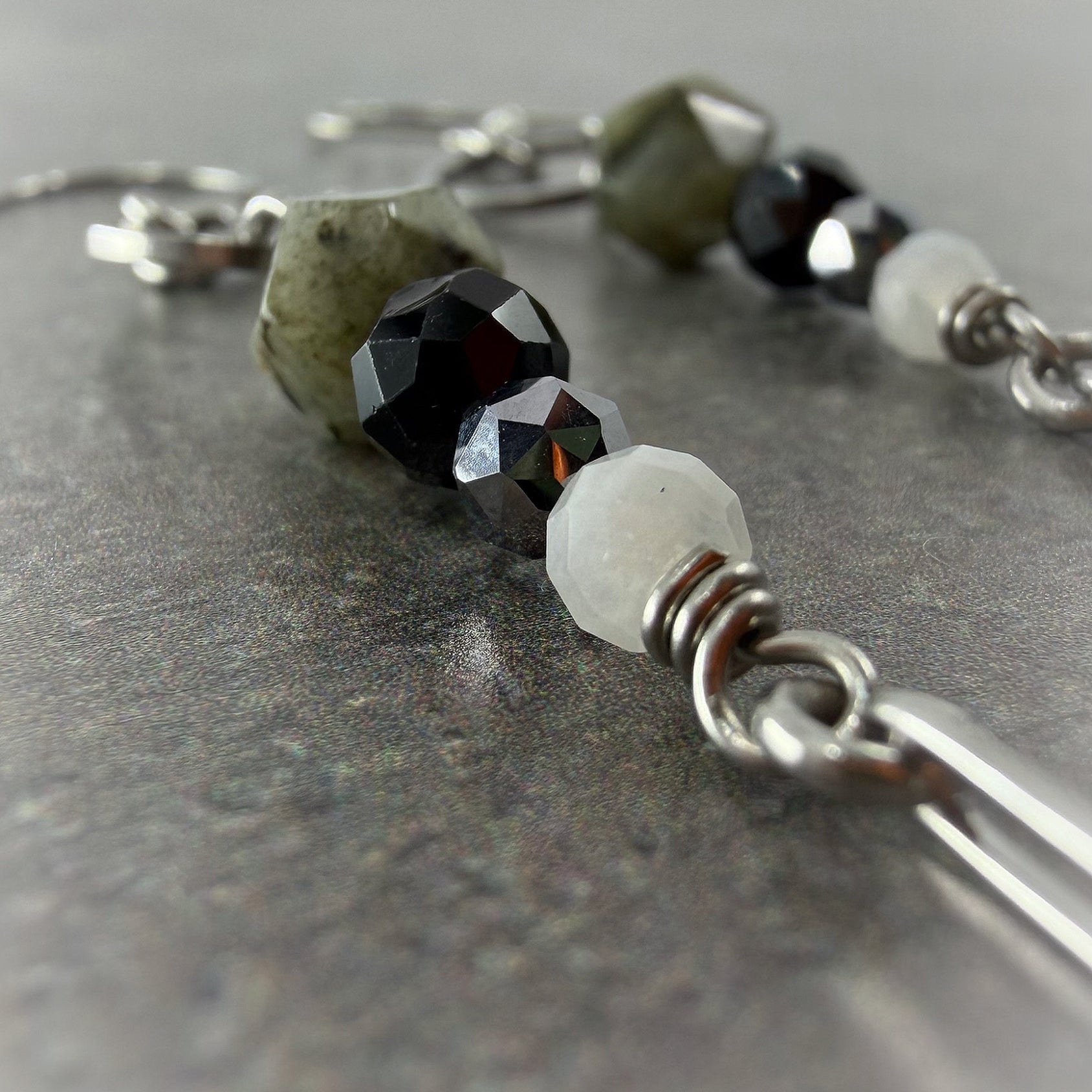 Mixed gemstone drop earrings featuring Labradorite, Black Spinel, Moonstone, and Terahertz set in stainless steel, in black, grey, white, and silver tones — Lawless Jewellery.