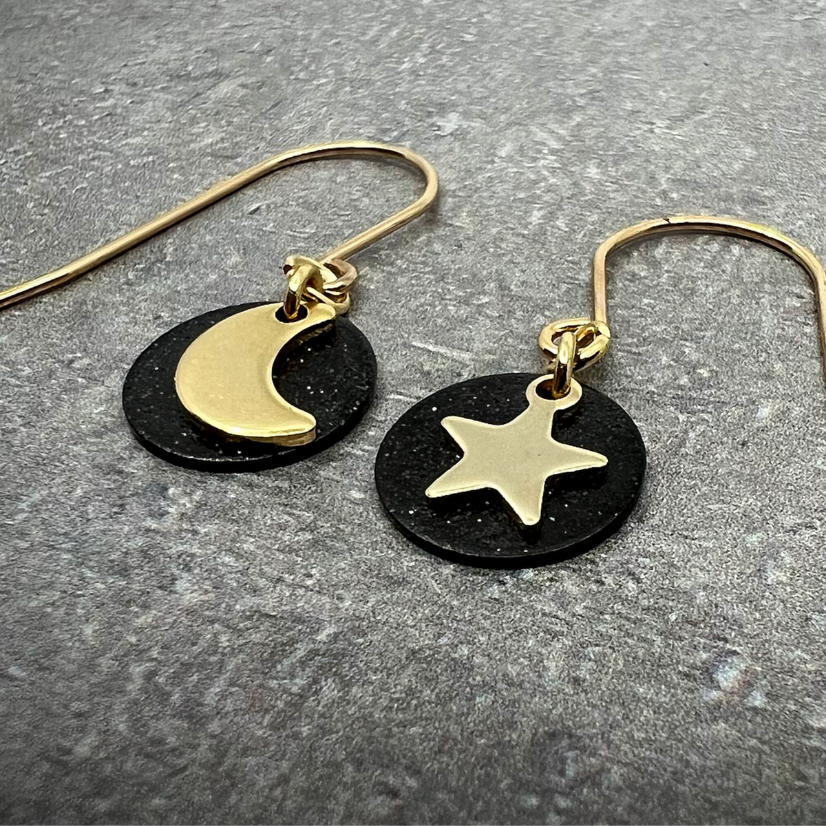 Gold and black stainless steel small drop earrings featuring moon, star, and disc design — limited edition from the Urania collection — Lawless Jewellery.