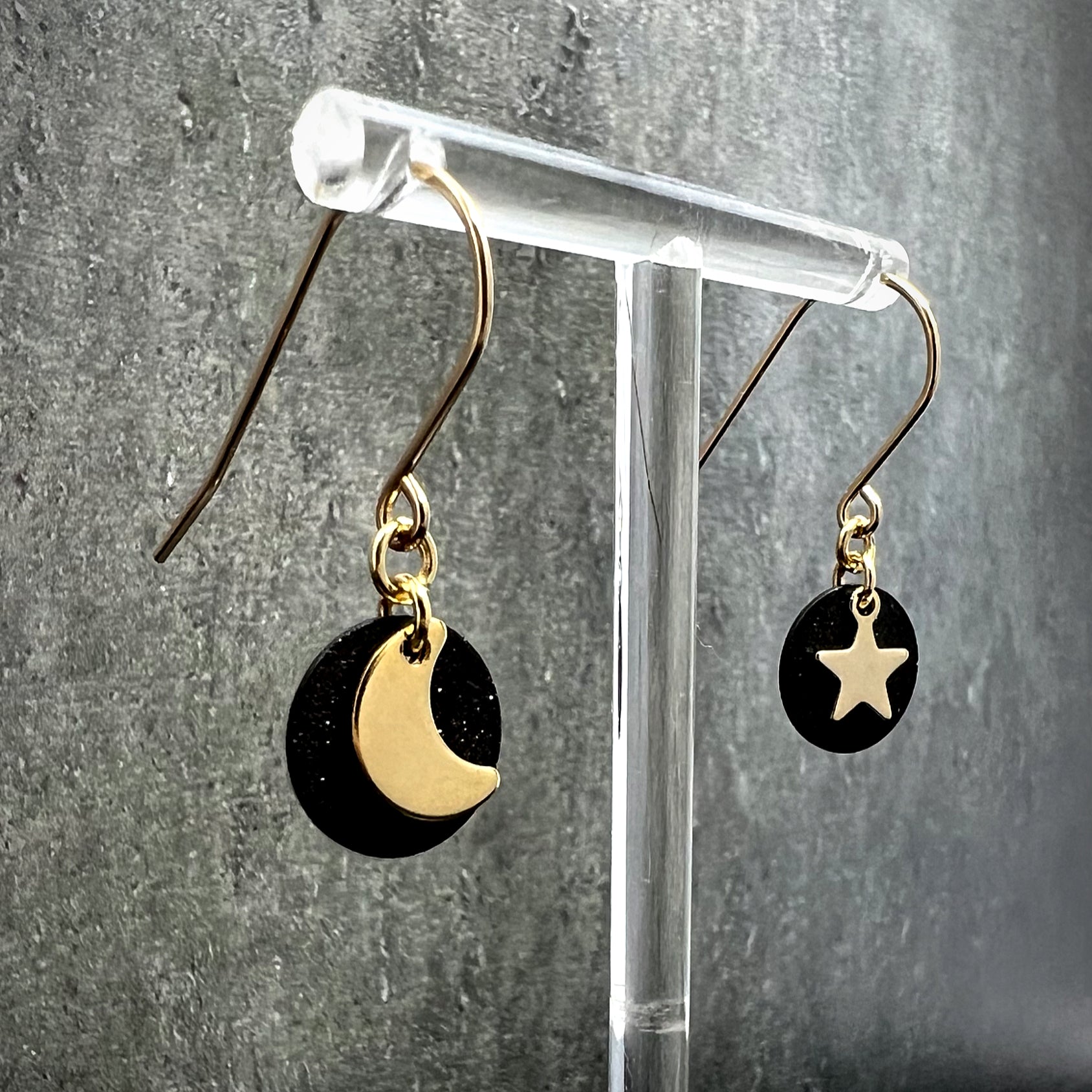Gold and black stainless steel small drop earrings featuring moon, star, and disc design — limited edition from the Urania collection — Lawless Jewellery.