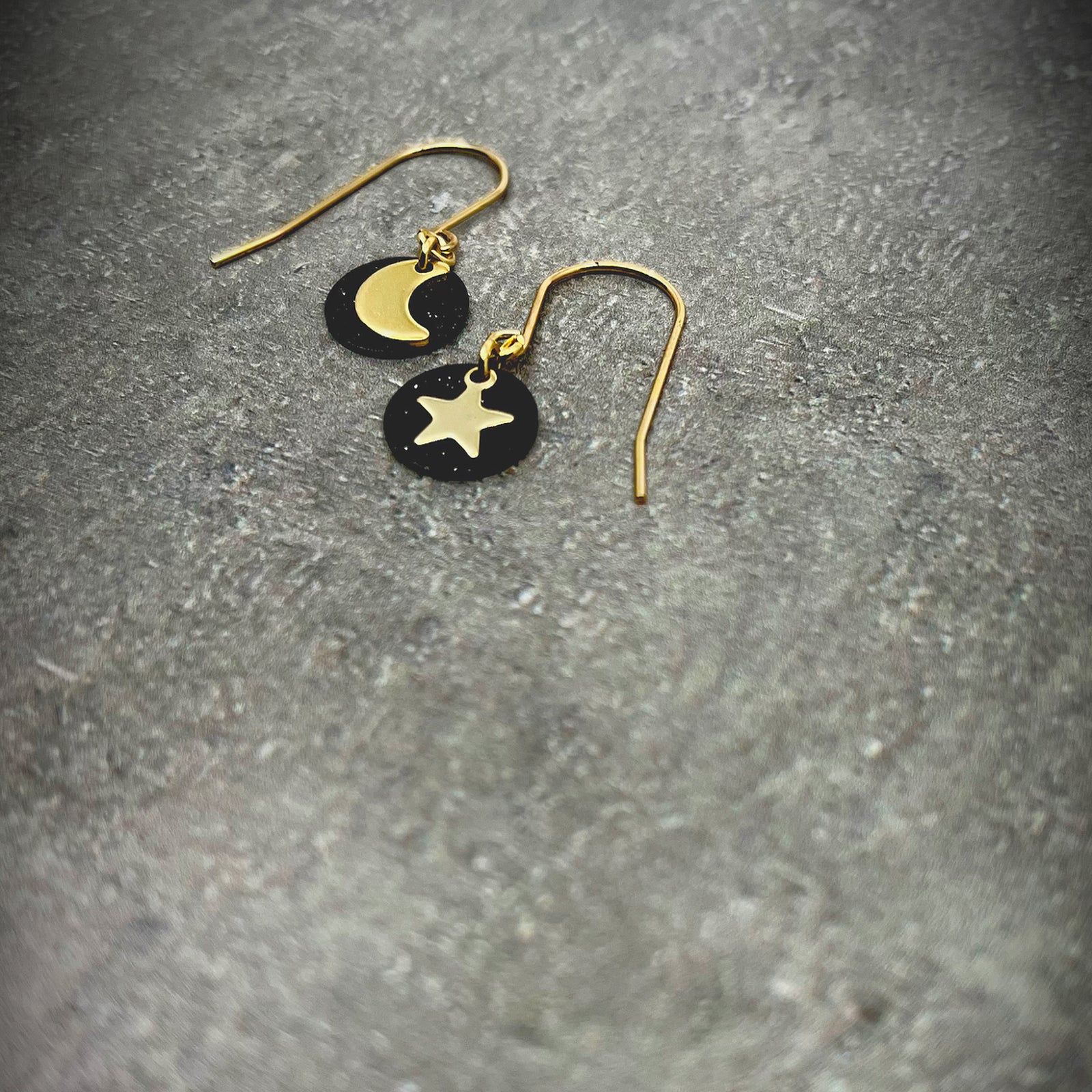 Gold and black stainless steel small drop earrings featuring moon, star, and disc design — limited edition from the Urania collection — Lawless Jewellery.
