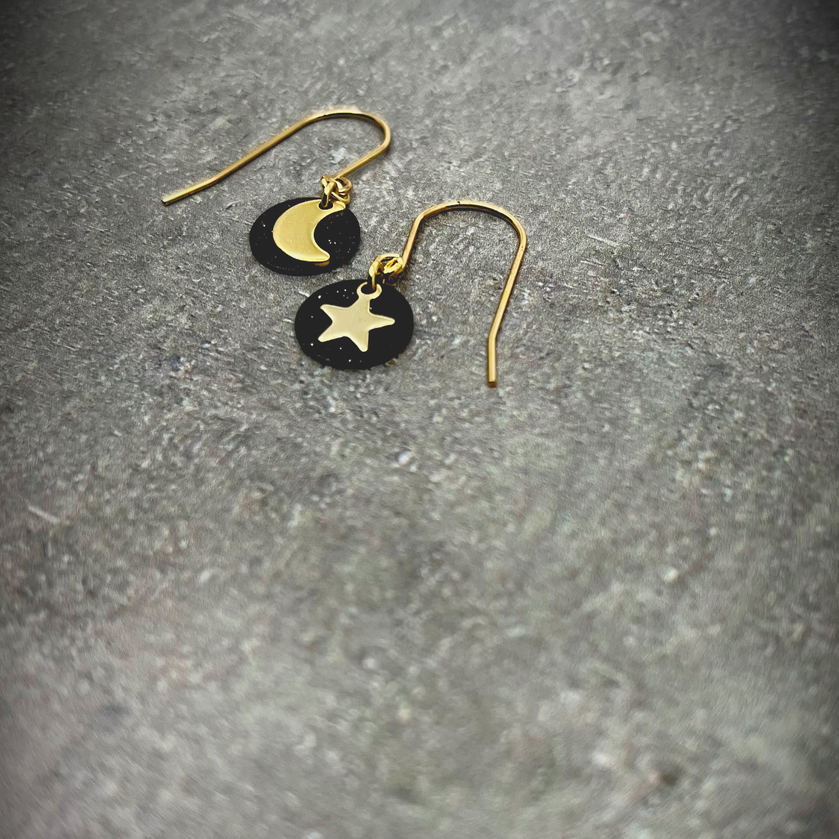 Gold and black stainless steel small drop earrings featuring moon, star, and disc design — limited edition from the Urania collection — Lawless Jewellery.