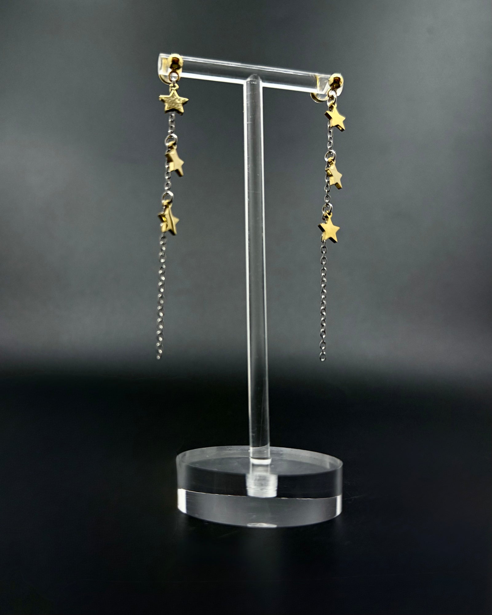 Short silver and gold star drop earrings with fine stainless steel chain, Urania Meridian Earrings 7 cm by Lawless Jewellery.