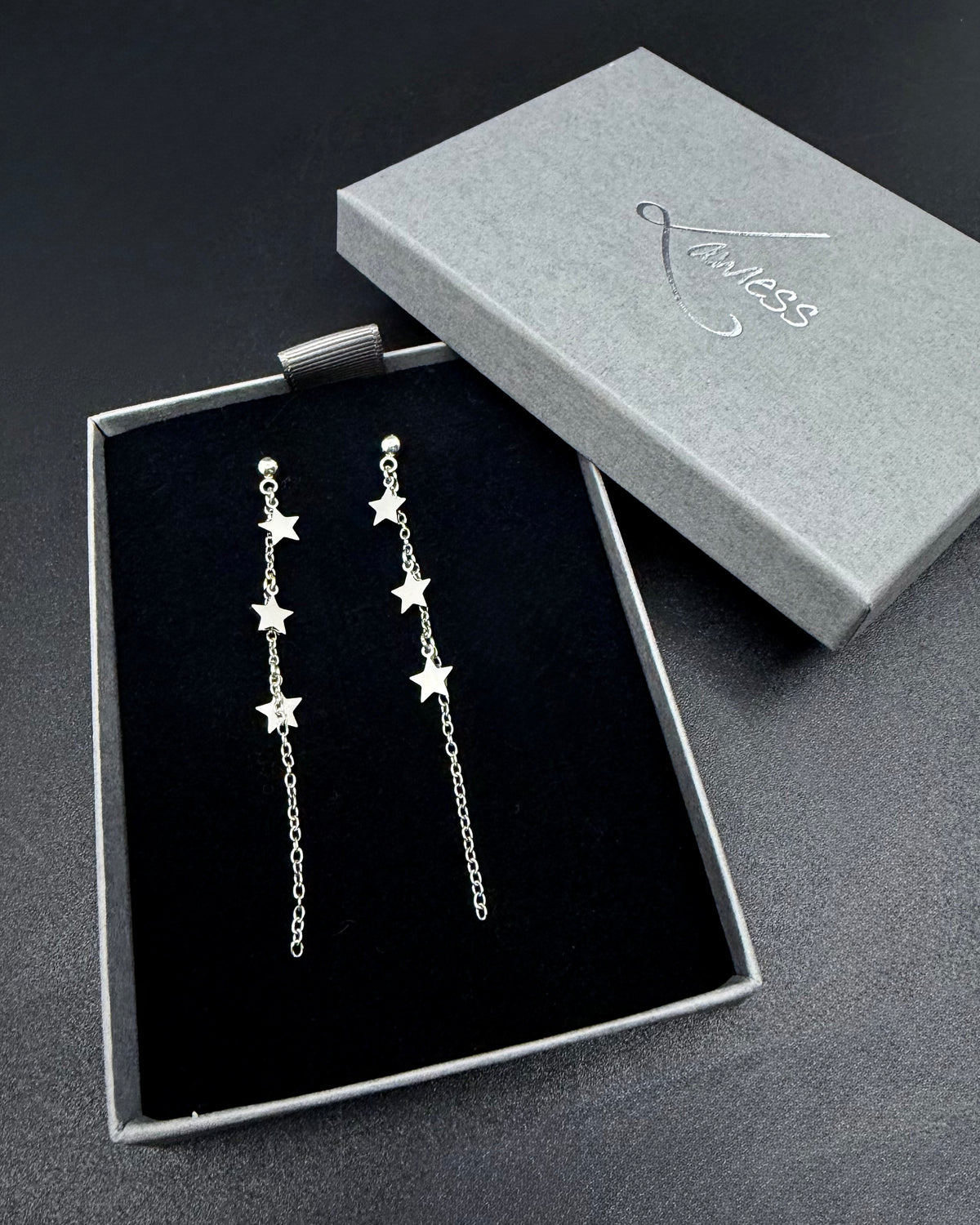 Short silver star drop earrings with fine stainless steel chain, Urania Meridian Earrings 7 cm by Lawless Jewellery