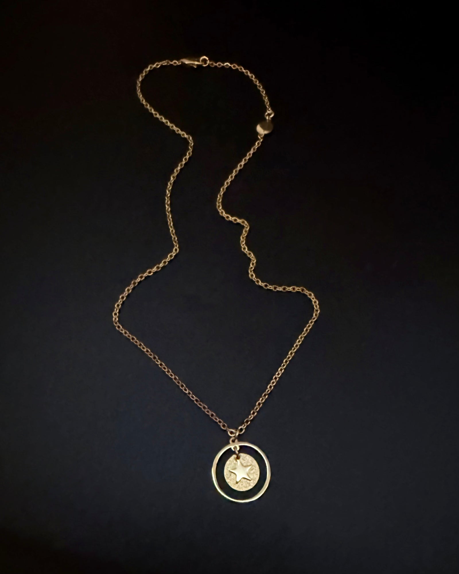 All gold reversible necklace with detachable moon and star charms, celestial pendant design in gold stainless steel, Urania Shapeshifter Necklace by Lawless Jewellery.