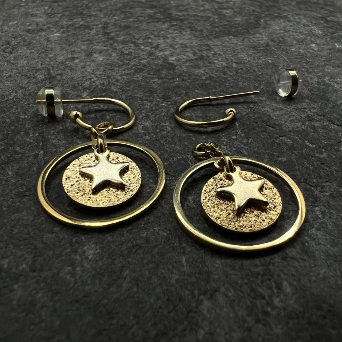 Gold stainless steel hoop earrings with detachable moon and star charms and a textured disc inside a 20 mm ring, 4 cm drop — Lawless Jewellery.