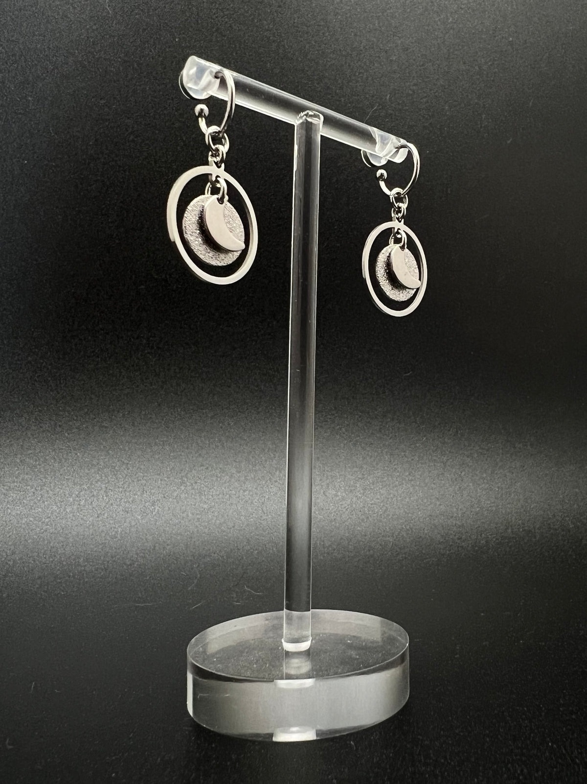 Silver stainless steel hoop earrings with detachable moon and star charms and a textured disc inside a 20 mm ring, 4 cm drop — Lawless Jewellery