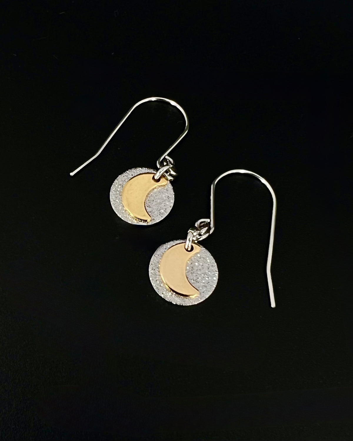 Urania Signal Moon earrings in silver and gold with textured disc and crescent moon detail, celestial drop earrings by Lawless Jewellery