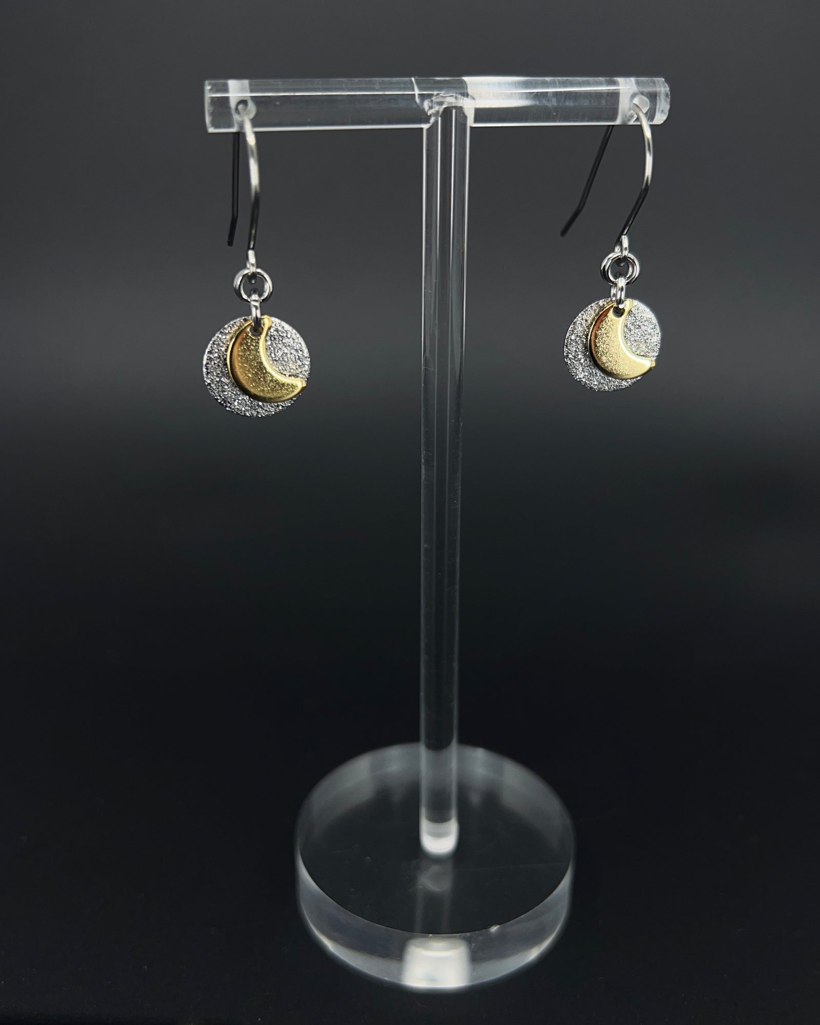 Urania Signal Moon earrings in silver and gold with textured disc and crescent moon detail, celestial drop earrings by Lawless Jewellery