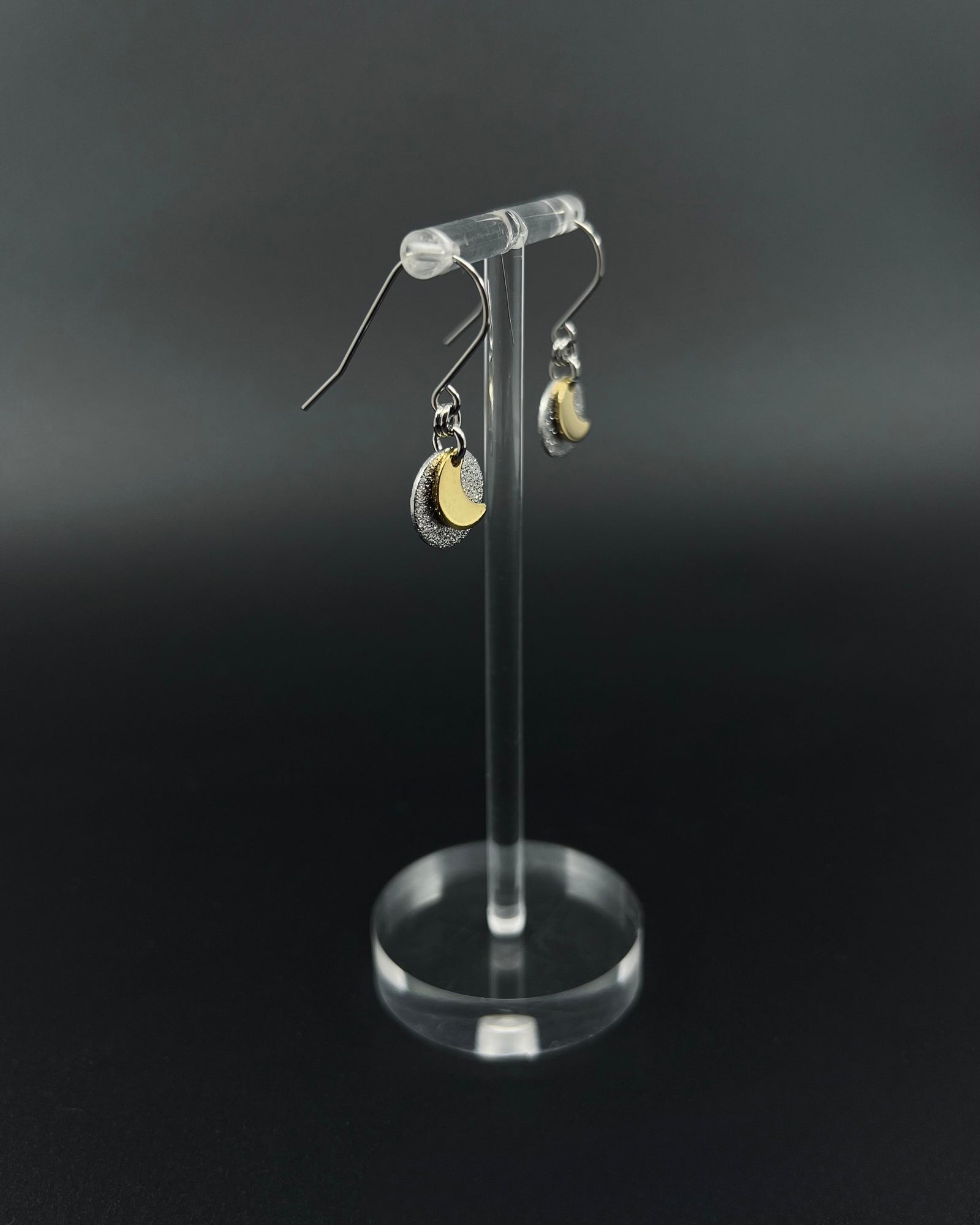Urania Signal Moon earrings in silver and gold with textured disc and crescent moon detail, celestial drop earrings by Lawless Jewellery