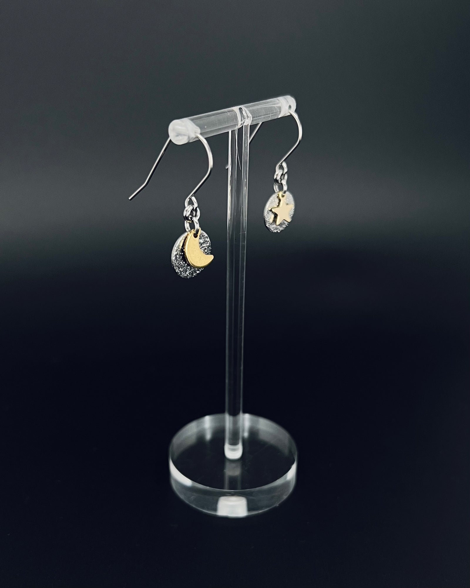 Silver and gold moon and star earrings with textured silver discs, minimalist celestial drop earrings by Lawless Jewellery
