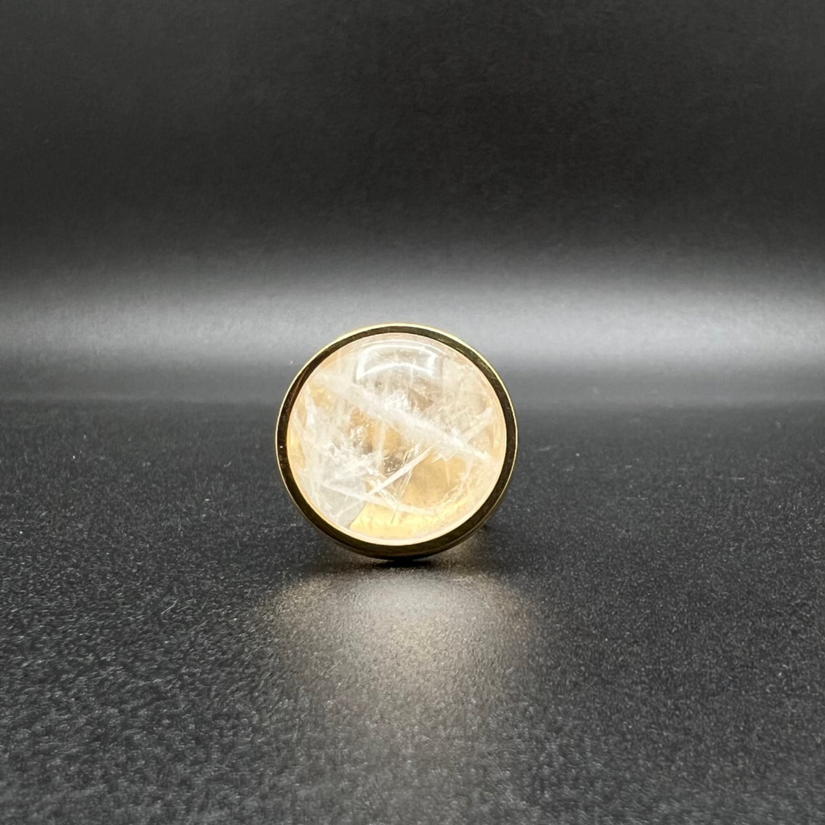 Set of three gold-plated stainless steel rings featuring 20 mm cabochons in Clear Quartz, Gold Druzy, and Carnelian on adjustable double-shank bands — Lawless Jewellery.